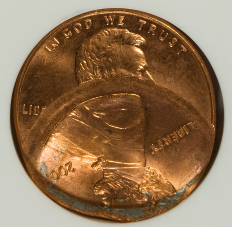 2001 penny multiple strikes error showing overlapping Lincoln portrait design elements from successive die impacts